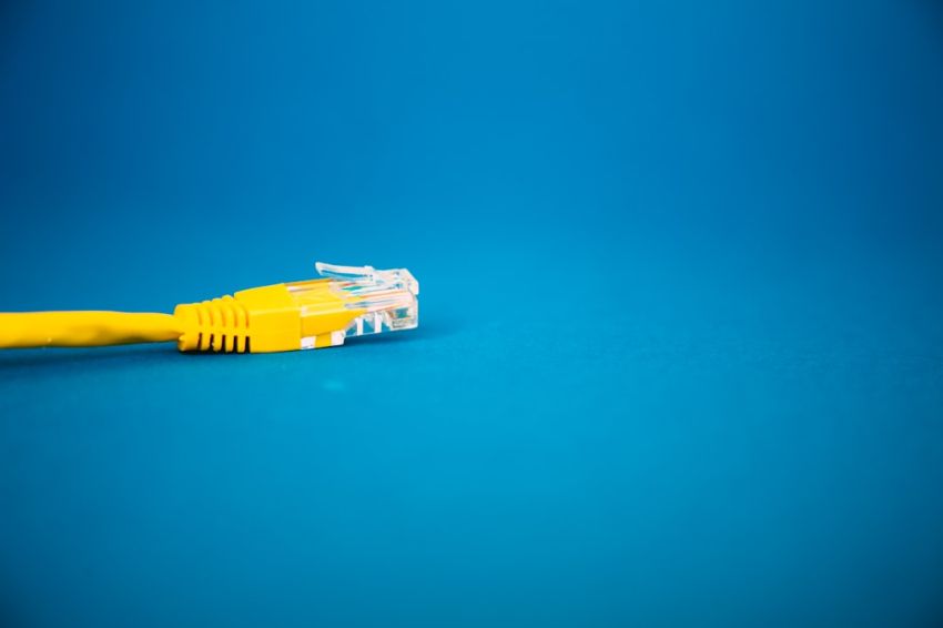 Lan - a yellow ethernet cable on a blue background