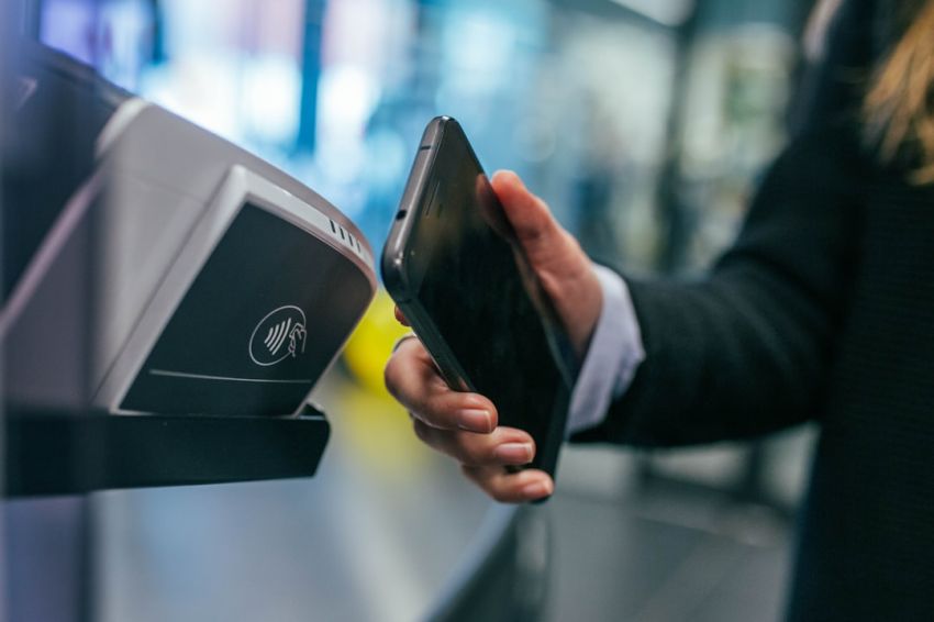 Mobile Payments - woman holding Android smartphone