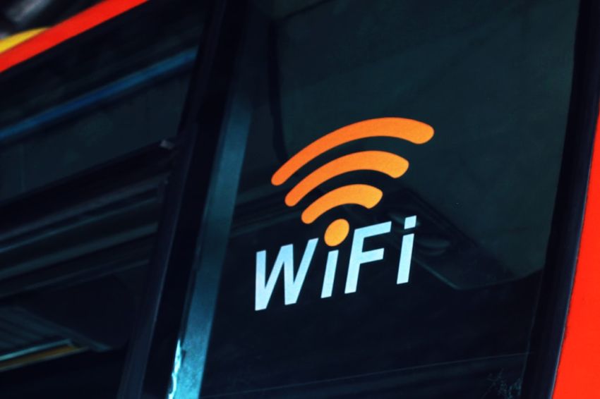 Wi-Fi - a close up of the wifi logo on the side of a bus